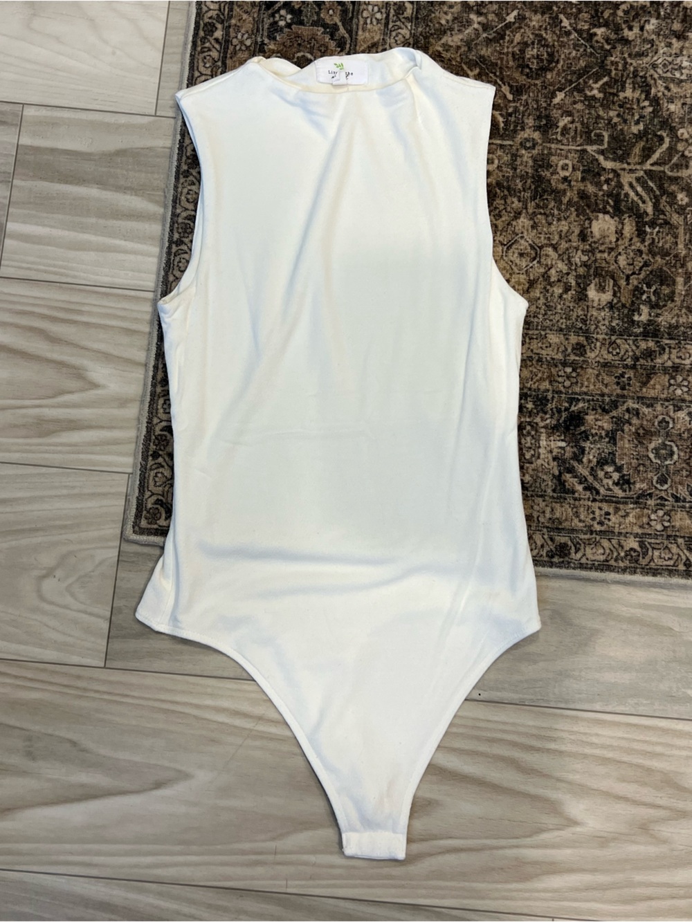 Sleeveless White High-Neck Bodysuit